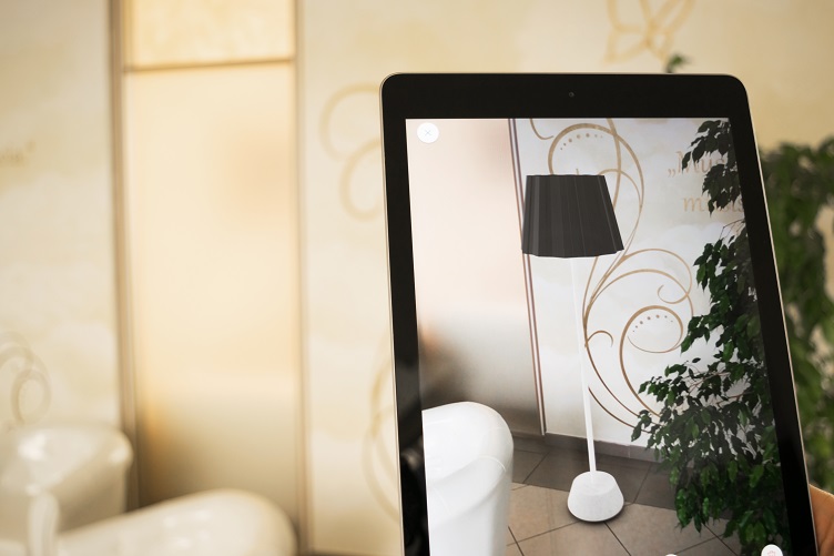 Person Choosing a Lamp With an AR App